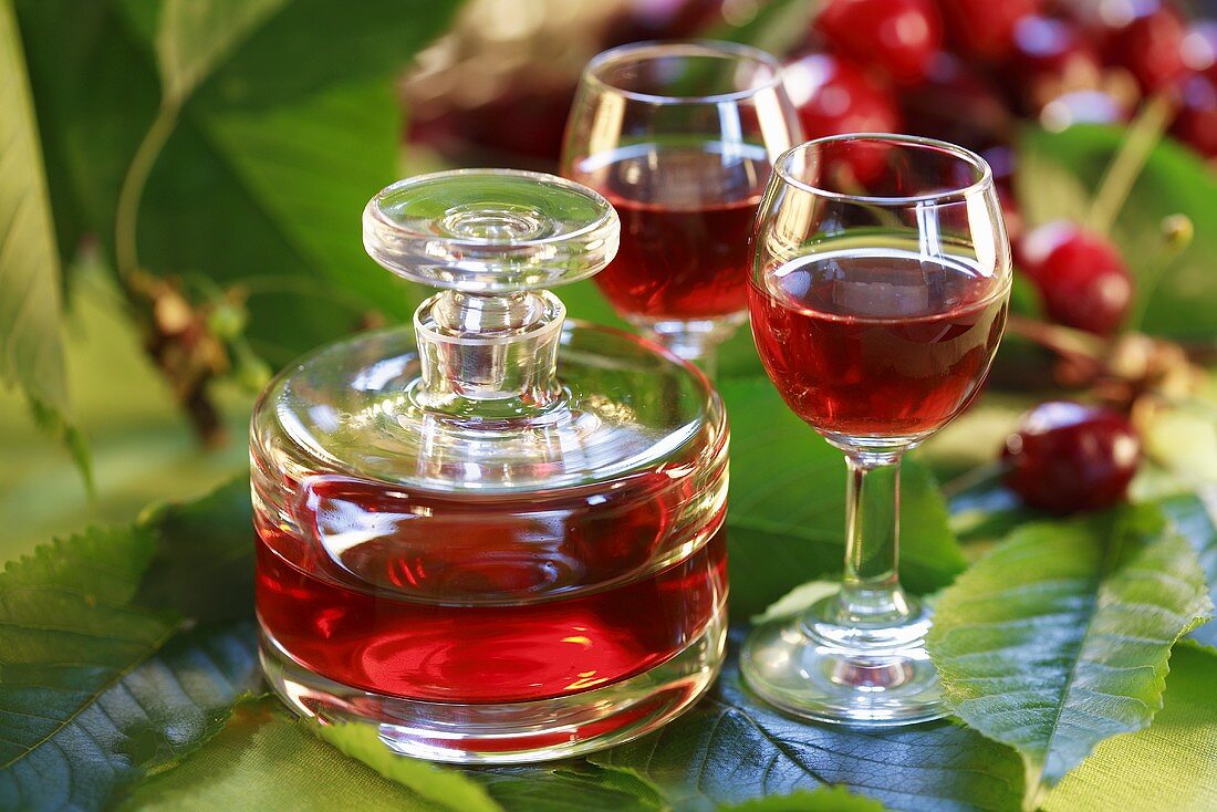 Cherry liqueur in decanter and glasses