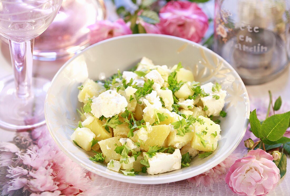 Summery potato salad with feta cheese and herbs