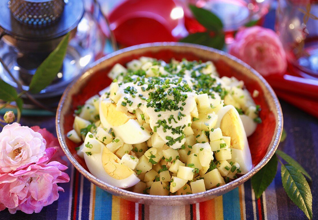 Potato salad with boiled egg and chives