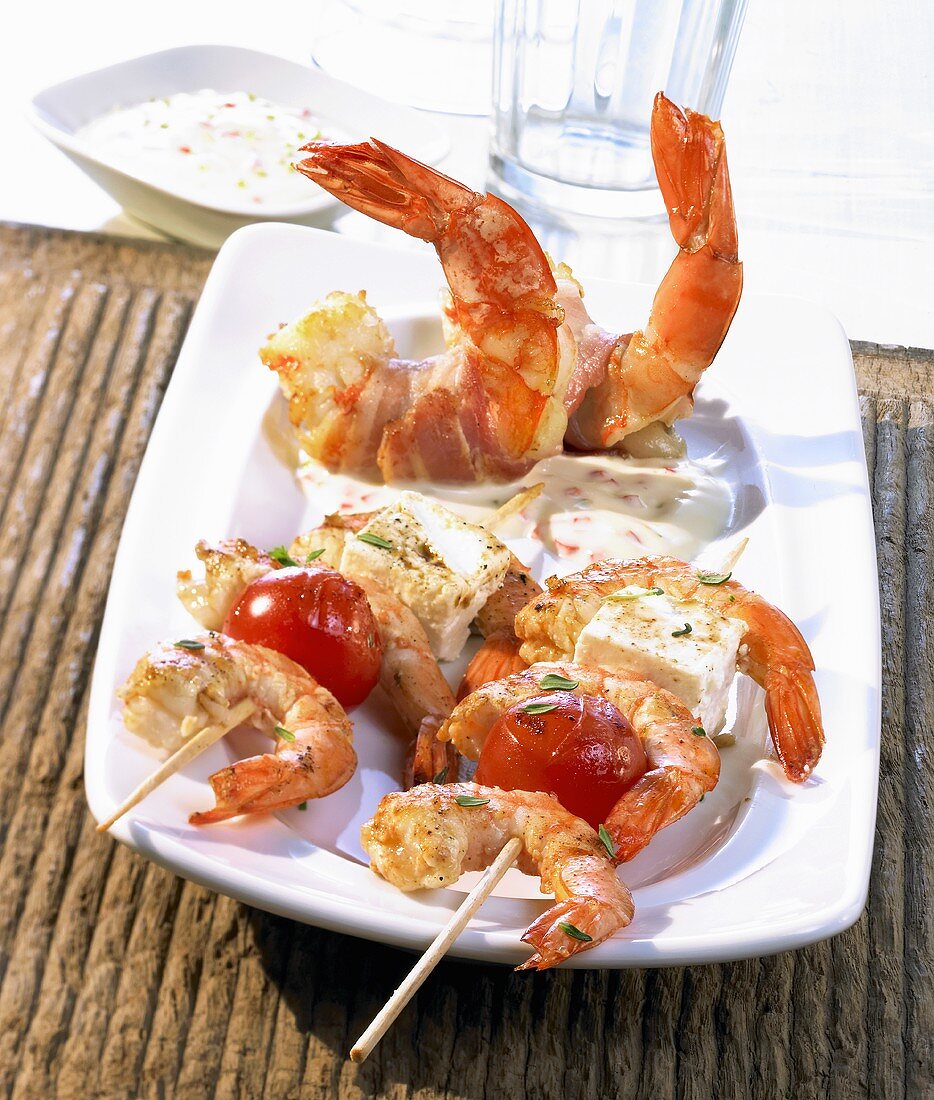 Grilled prawn and feta kebabs and bacon-wrapped prawns