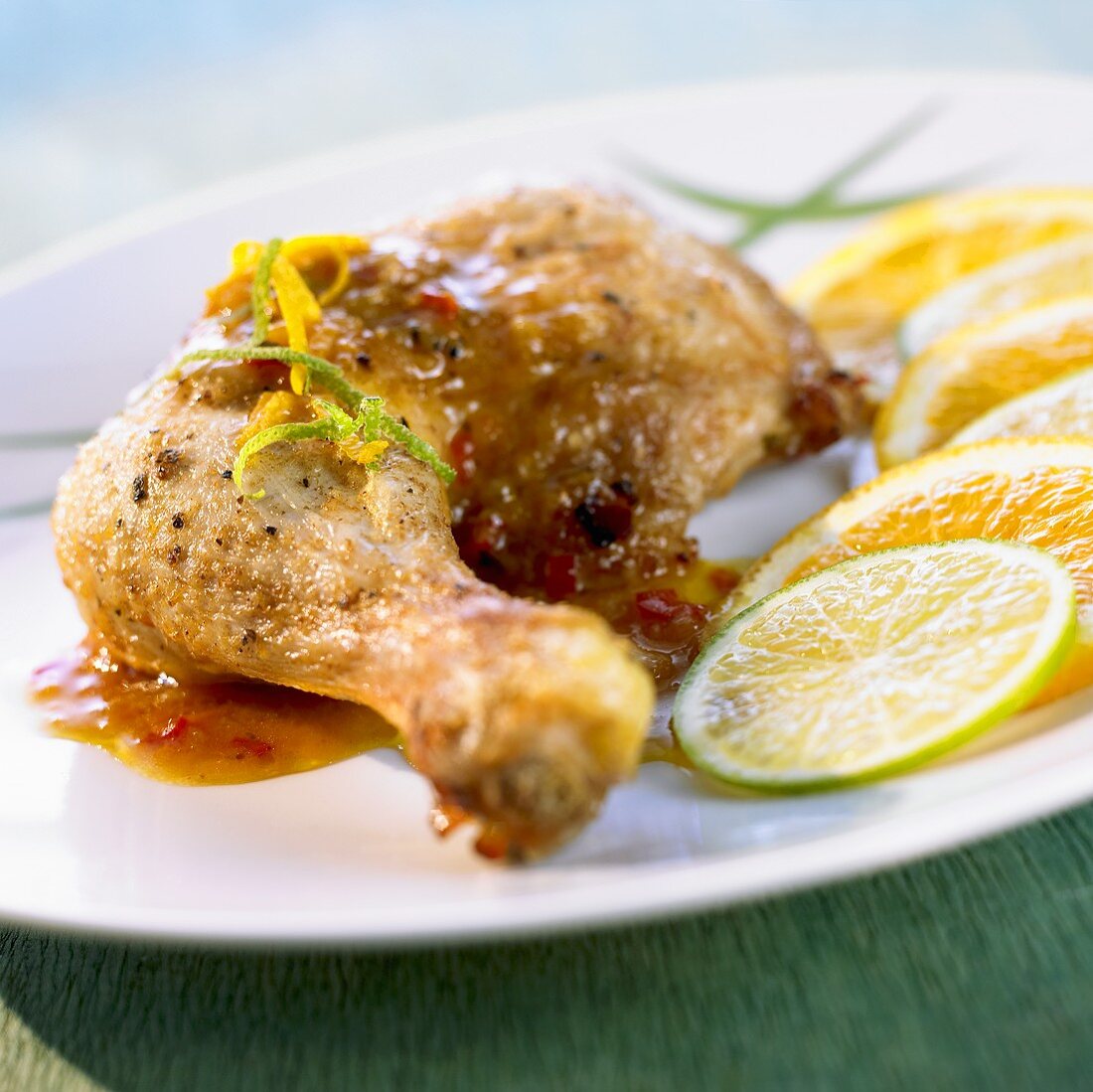 Cuban chicken with orange and lime slices