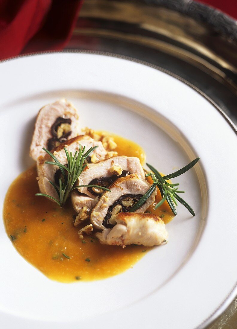 Chicken breast with date stuffing on apricot & rosemary sauce