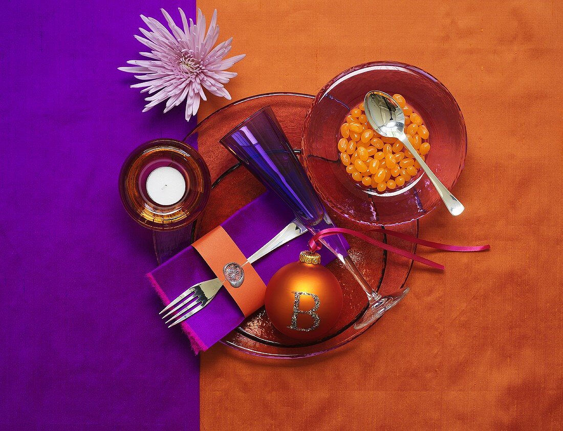 Purple and orange Christmas place-setting with jelly beans