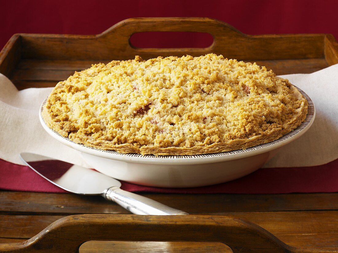 Rhubarb crumble with sour cream in pie dish