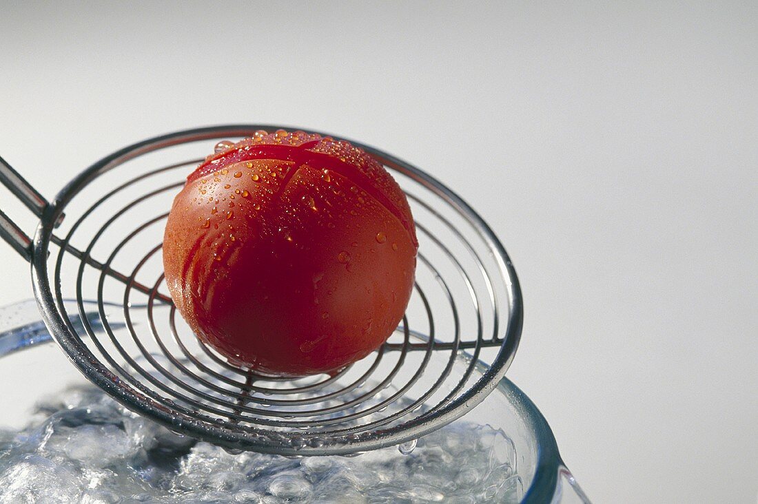 Blanched tomato on a skimmer