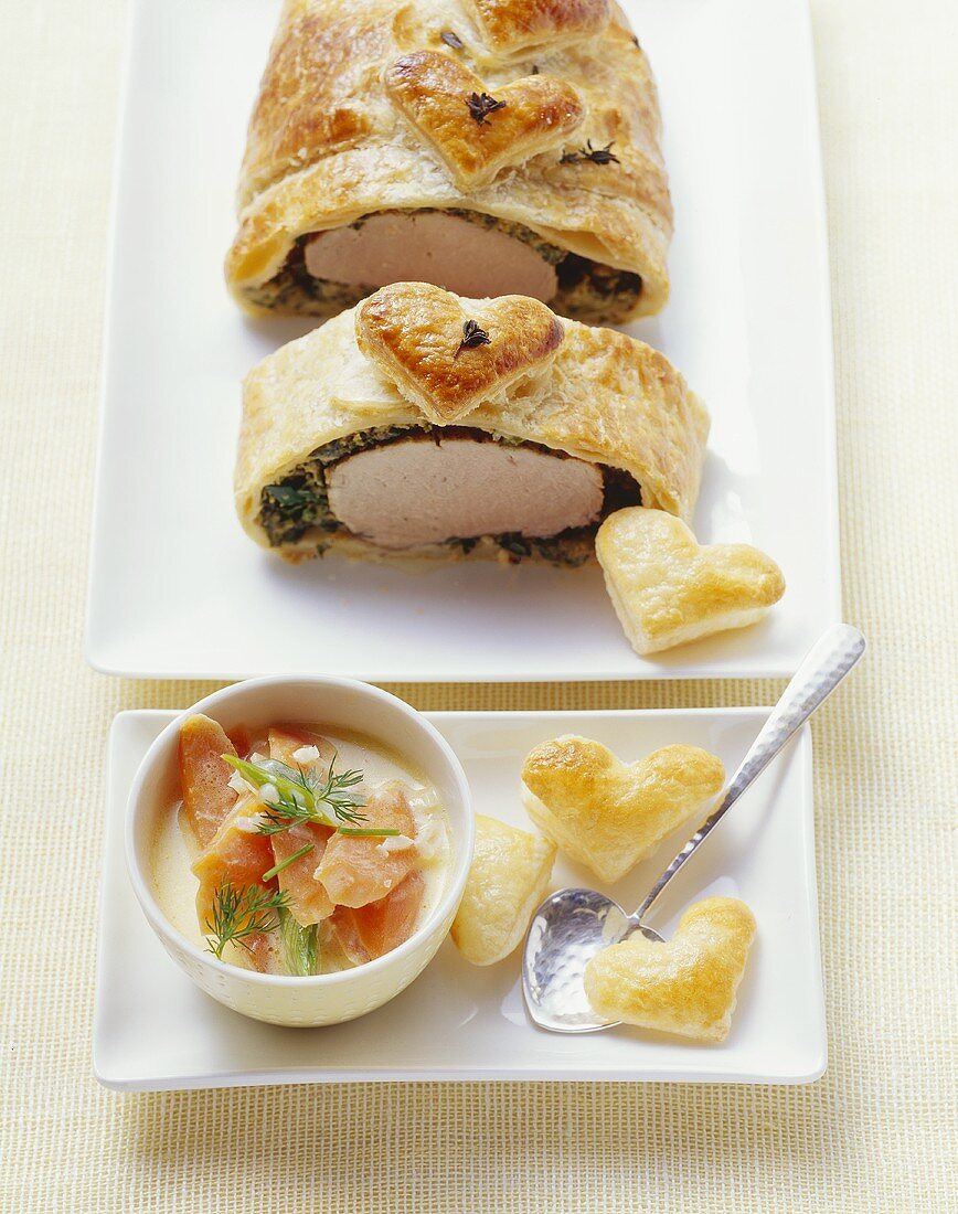 Pork fillet with herbs in puff pastry, with creamy carrots