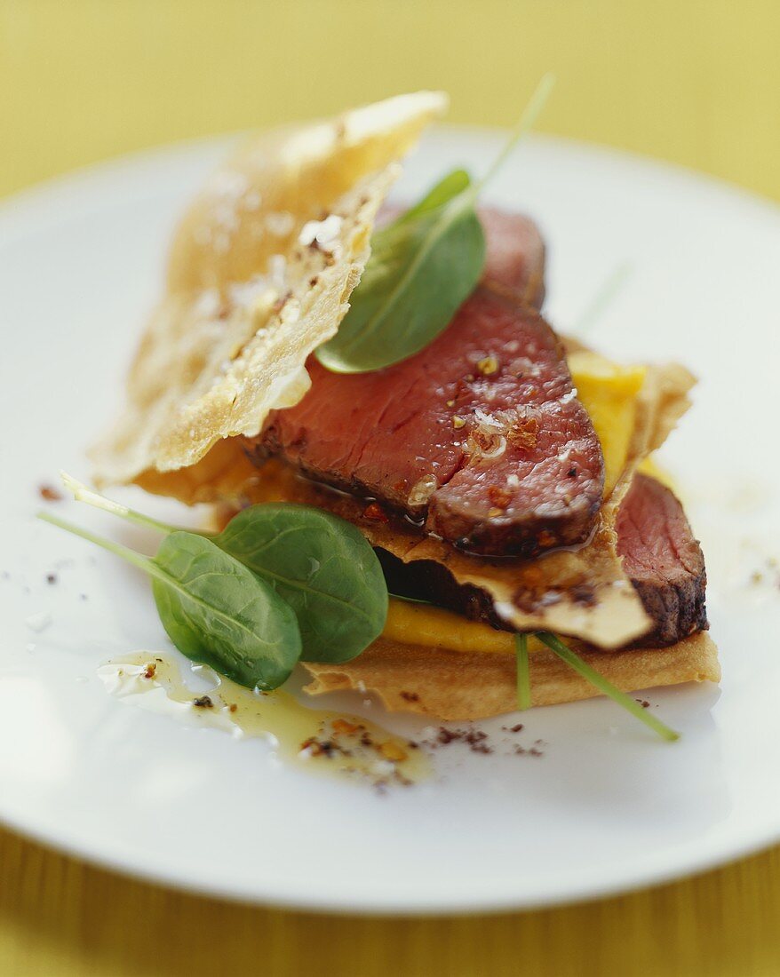 Veal fillet with strudel pastry leaves, spinach & pumpkin puree