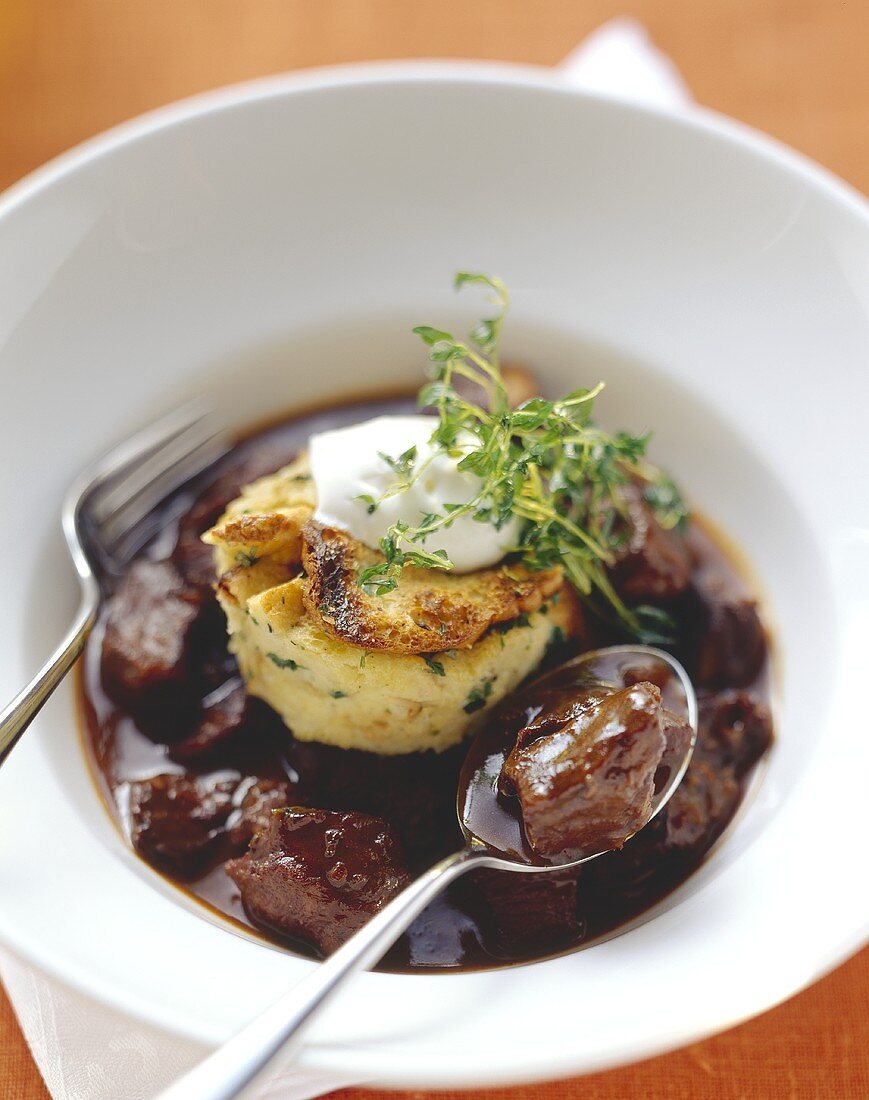 Peppered pork with herb dumpling and sour cream