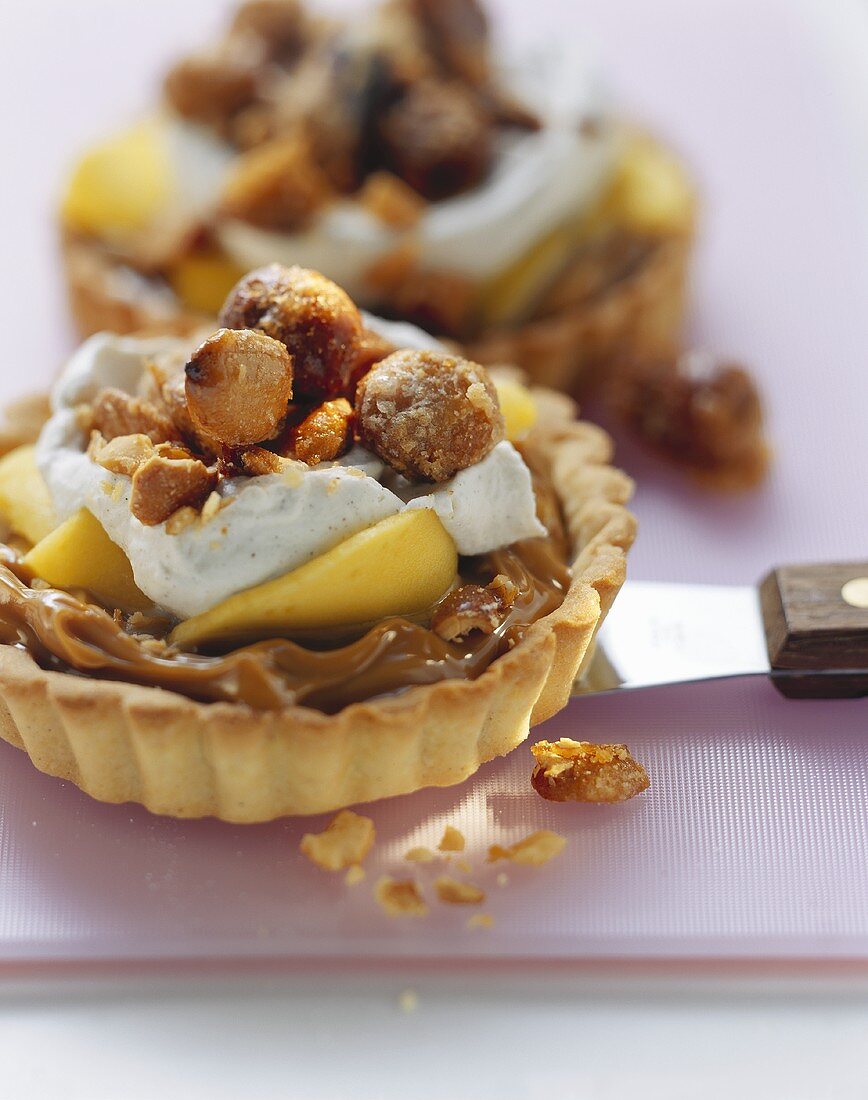 Vanilla and toffee tart with mango and caramelised almonds