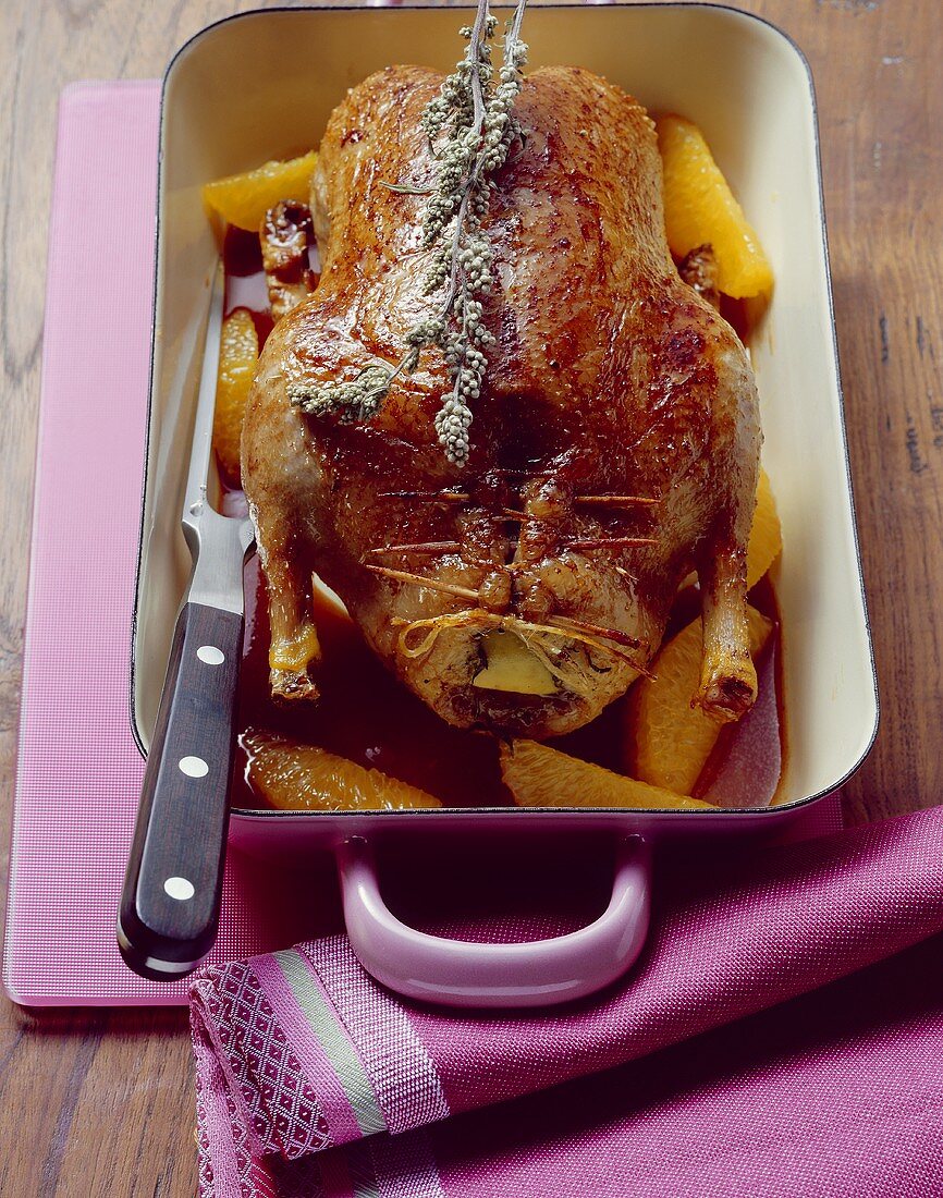 Roast wild duck with apple stuffing and orange sauce