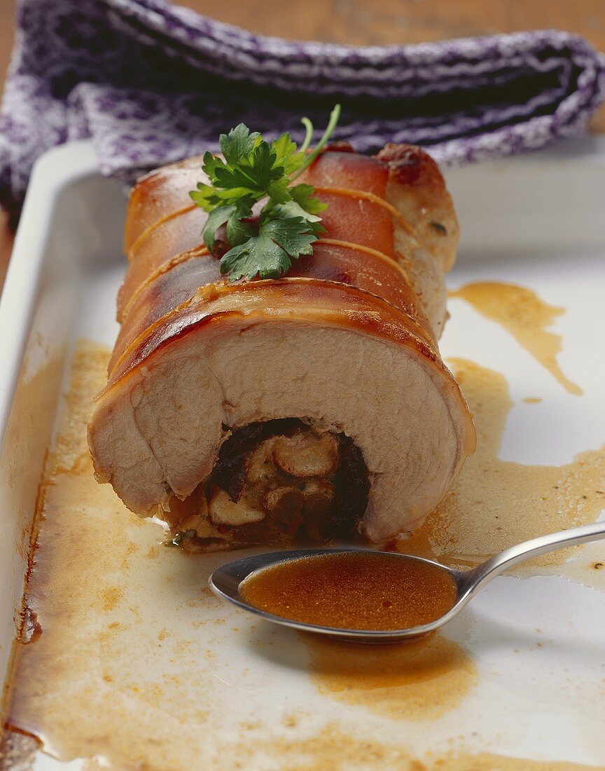 Rolled roast suckling pig with prunes and apricots