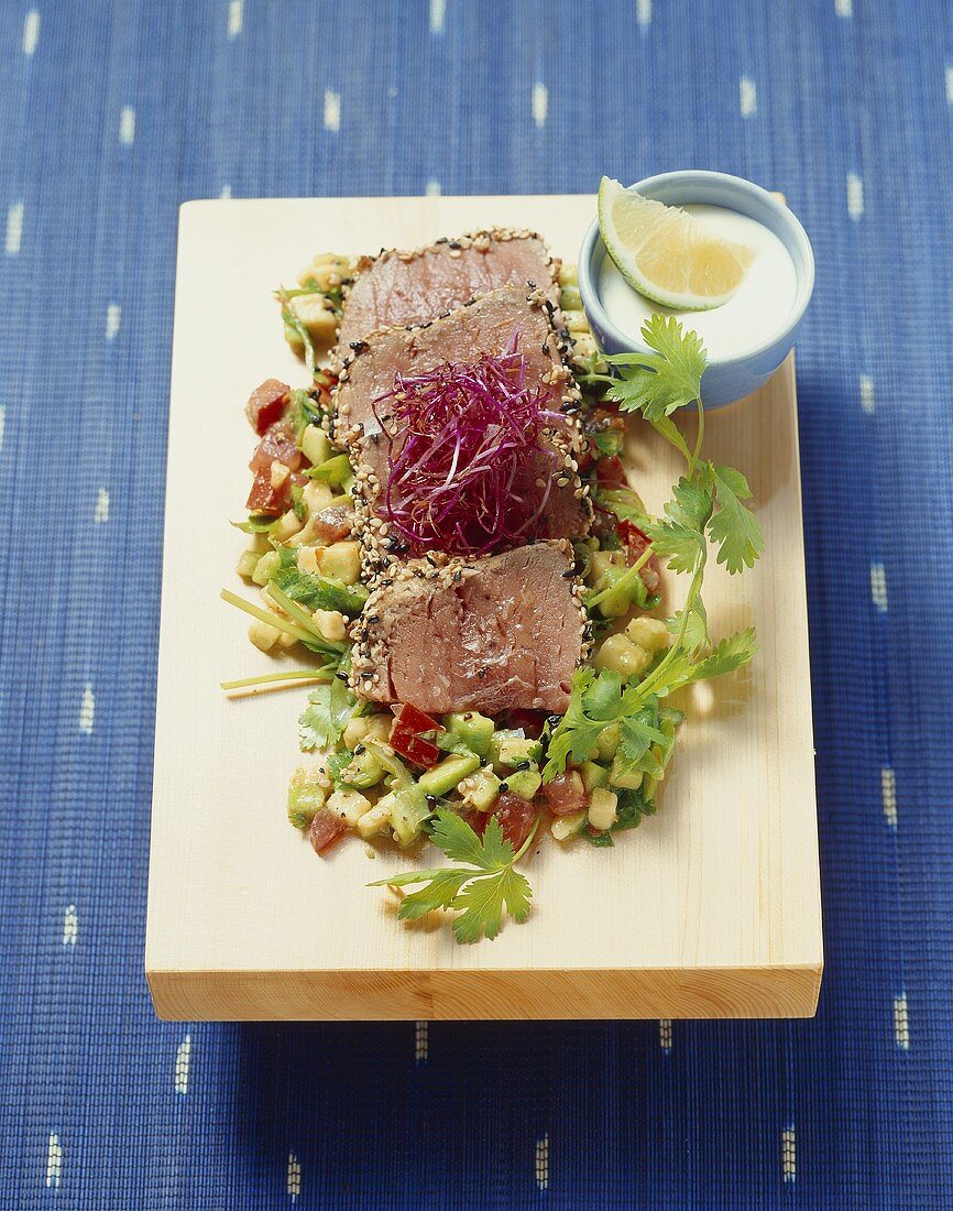 'Black and white' tuna with avocado and sprouts