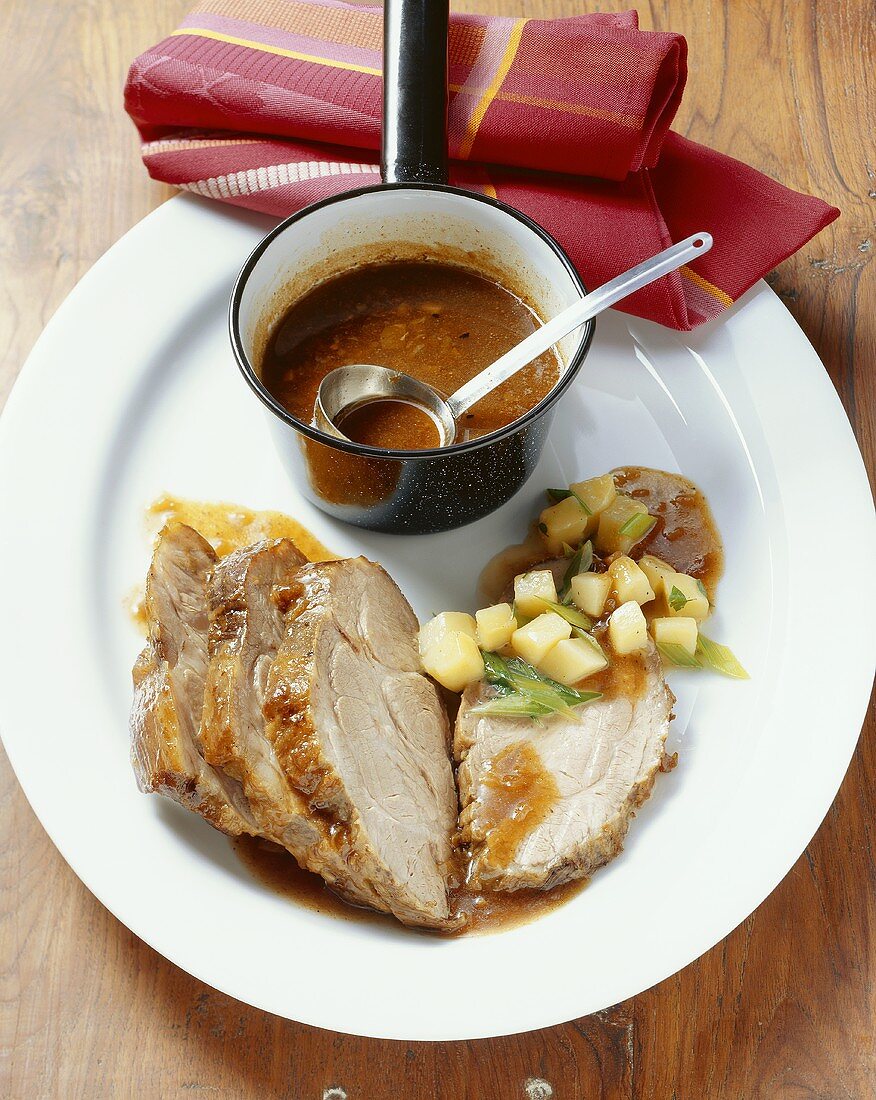 Pork neck and potatoes with ramsons (wild garlic)