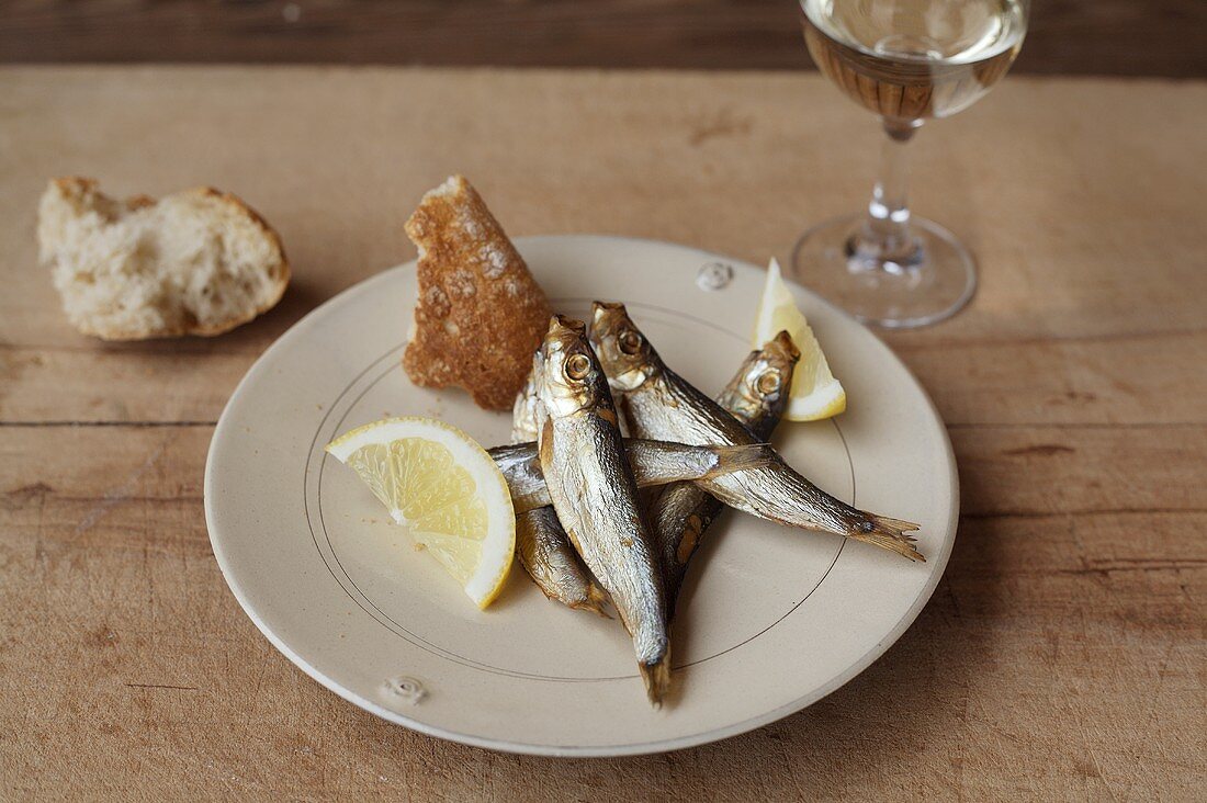 Sprats with bread and white wine