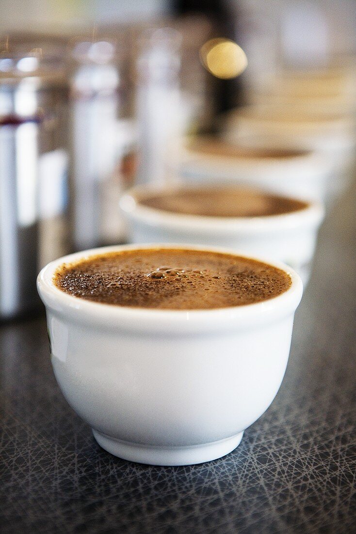 Coffee in white bowls (for coffee tasting)