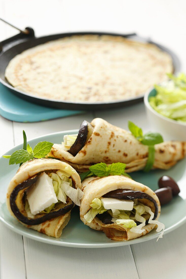 Pancakes filled with aubergine and feta cheese