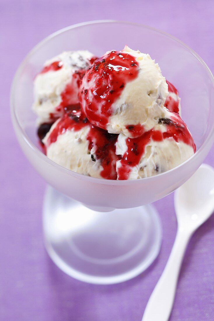 Nut and almond ice cream with fruit sauce