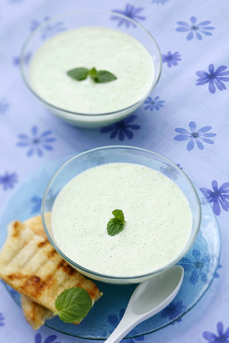 Cold cucumber soup with mint leaves