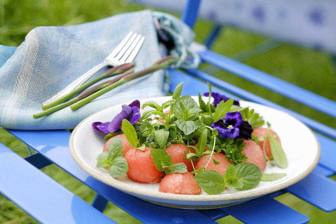 Watermelon with herbs and pansies