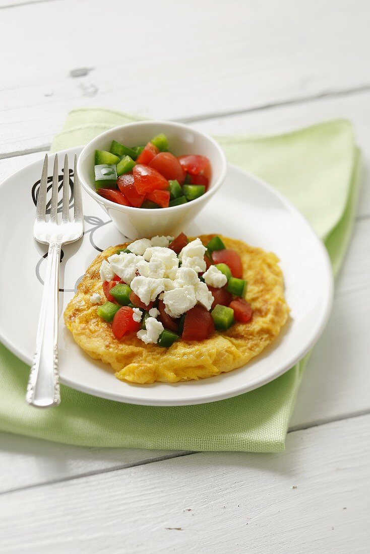 Omelette with cucumber, tomato and feta cheese