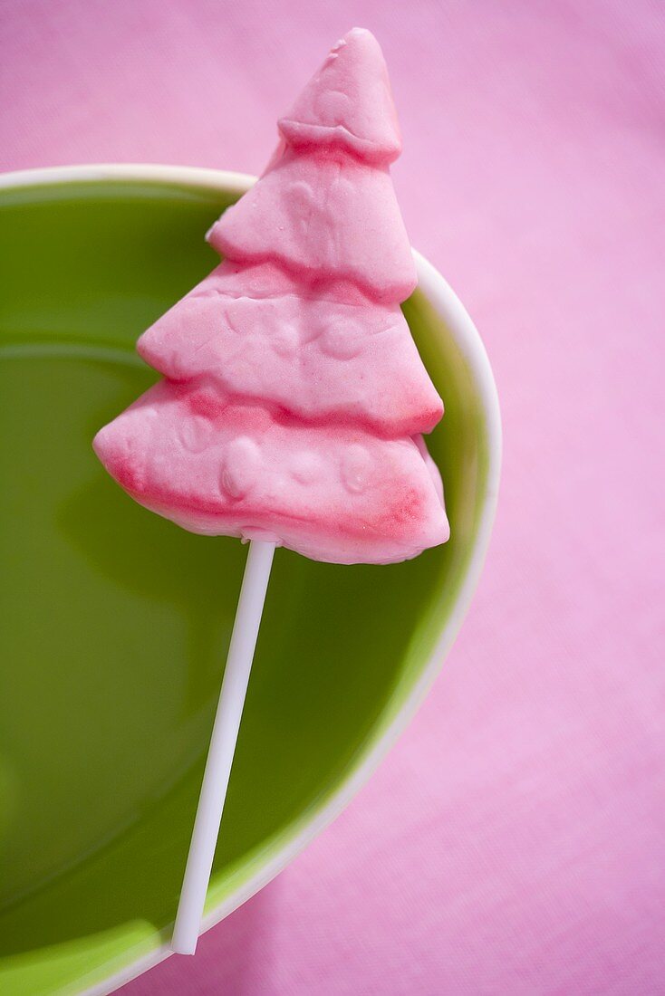 Pink lollipop in the shape of a fir tree