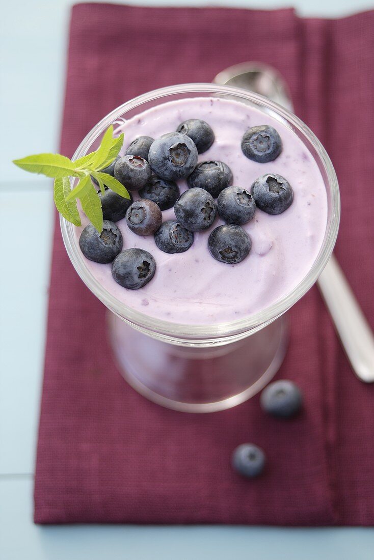 Blueberry quark with fresh berries in a glass