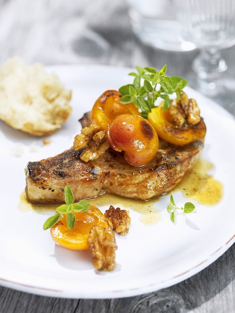 Caramelised pork chop with apricots and walnuts