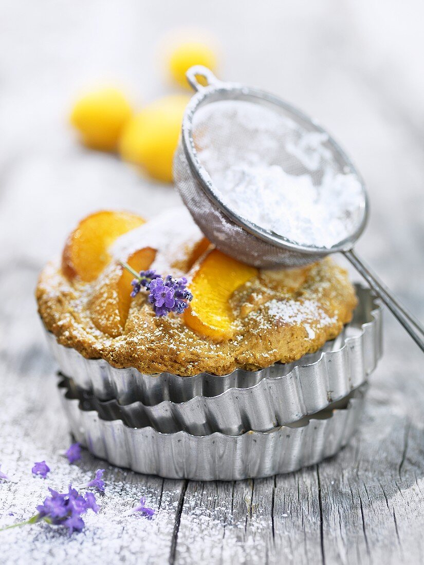Lavender and apricot tart with icing sugar