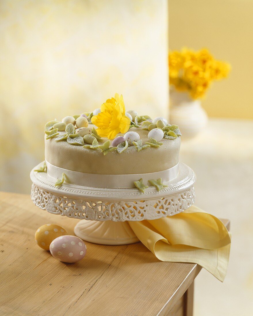 Easter cake with sugar eggs and daffodil