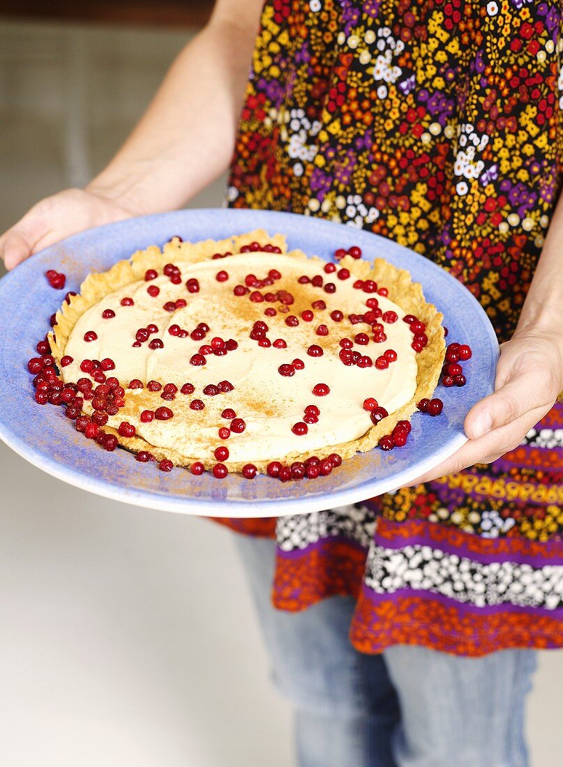 Cranberry tart sprinkled with cinnamon