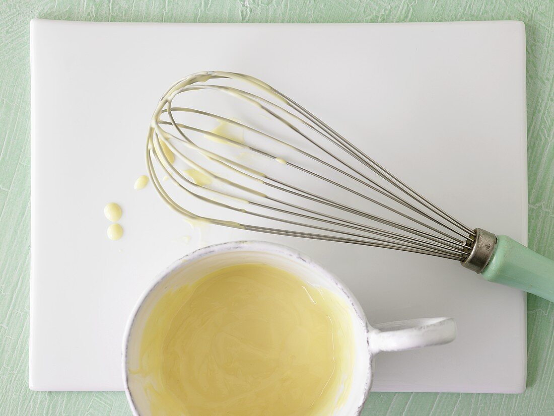 Whisk with sauce