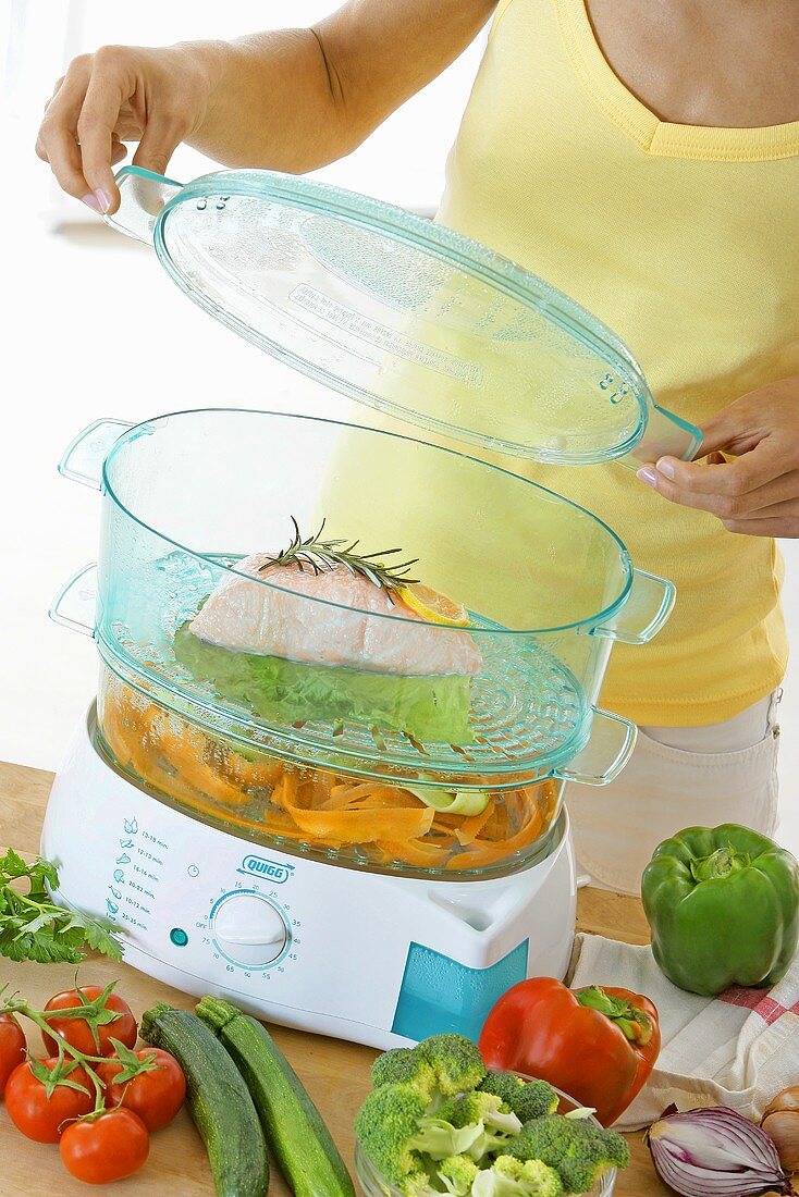 Fish and vegetables in a steamer