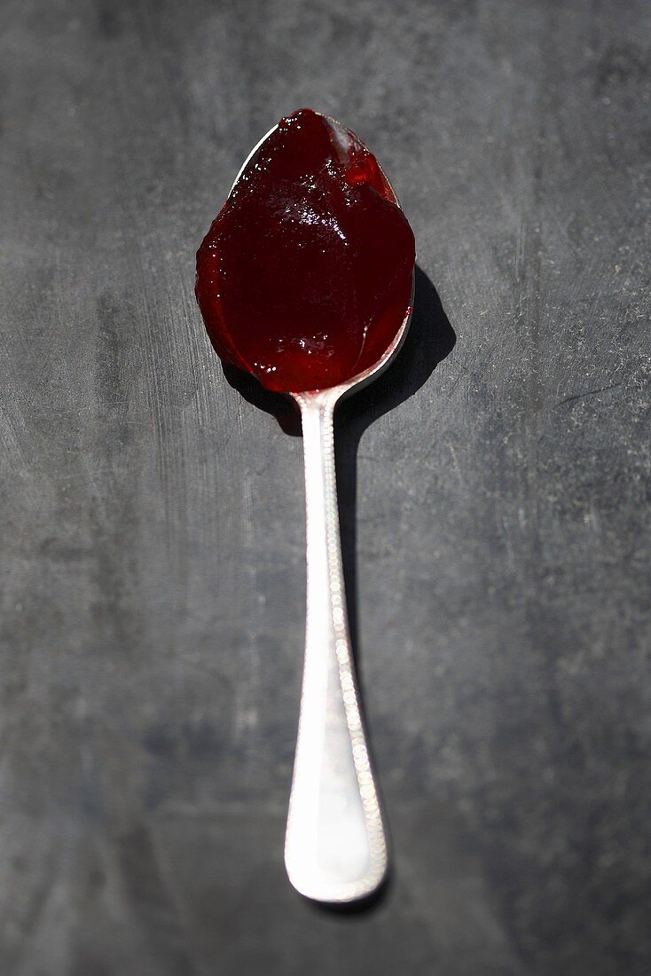 Raspberry jelly on spoon