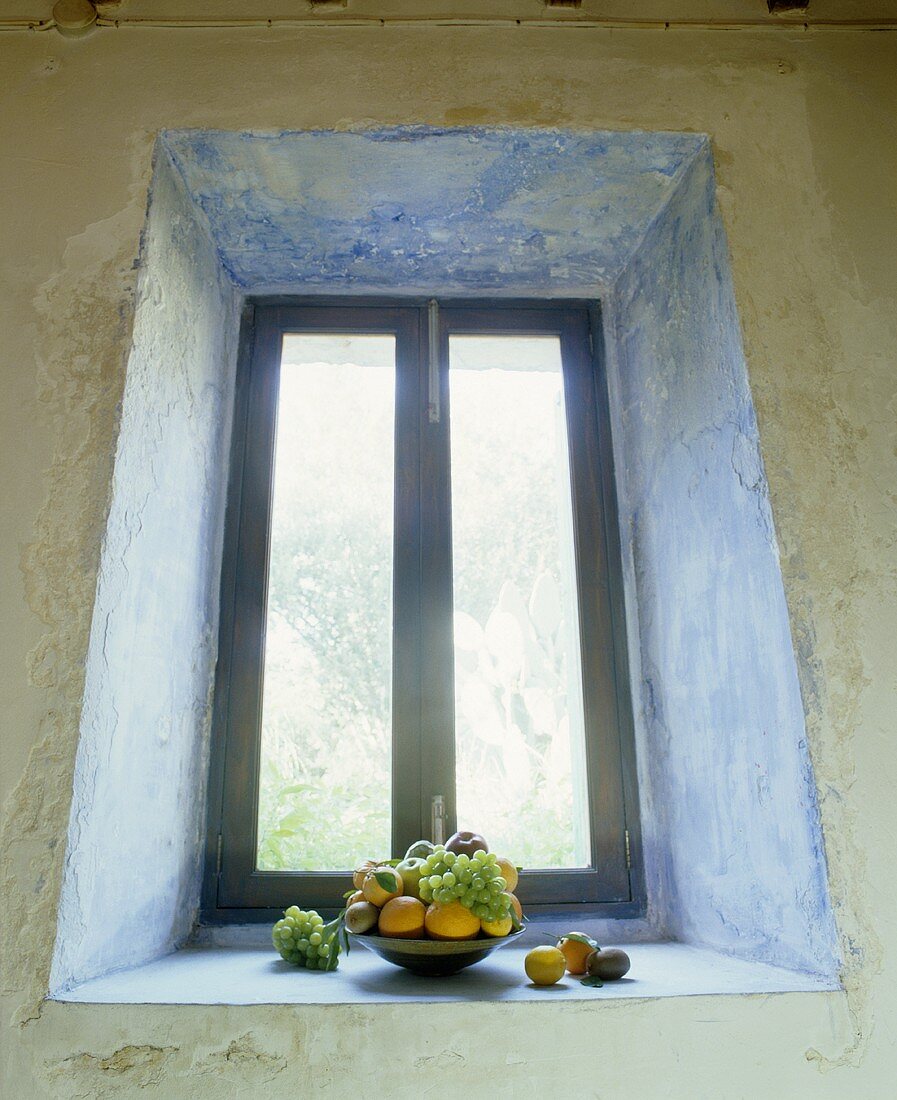 Bowl of fruit on a window-sill