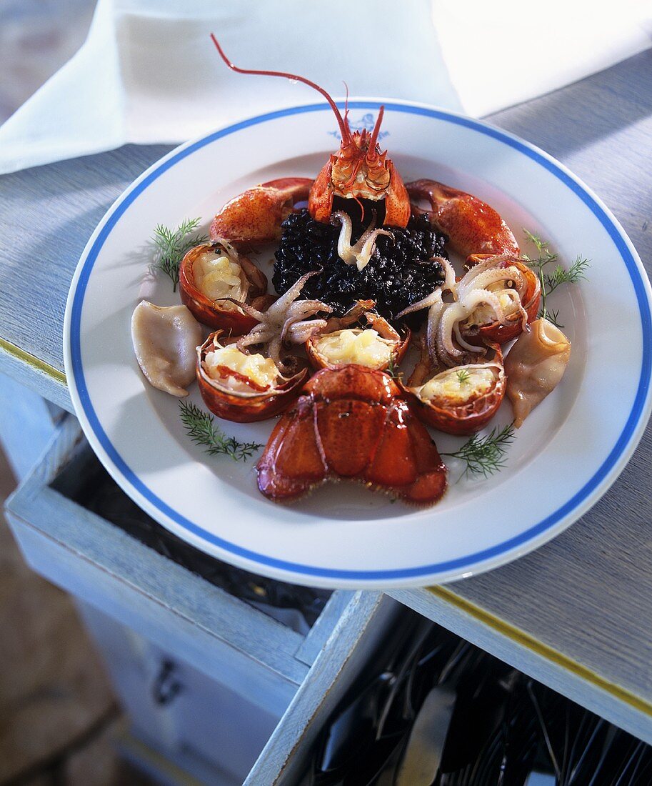 Lobster with black rice and squid