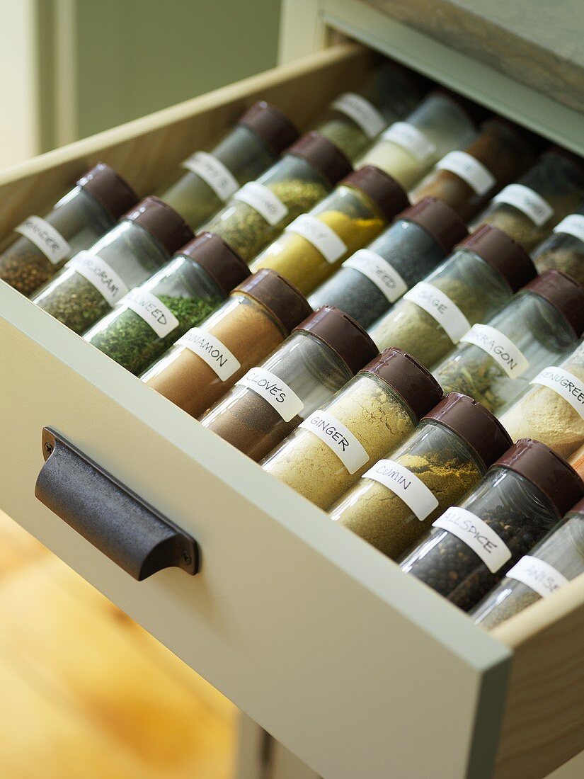 Spice jars in a drawer