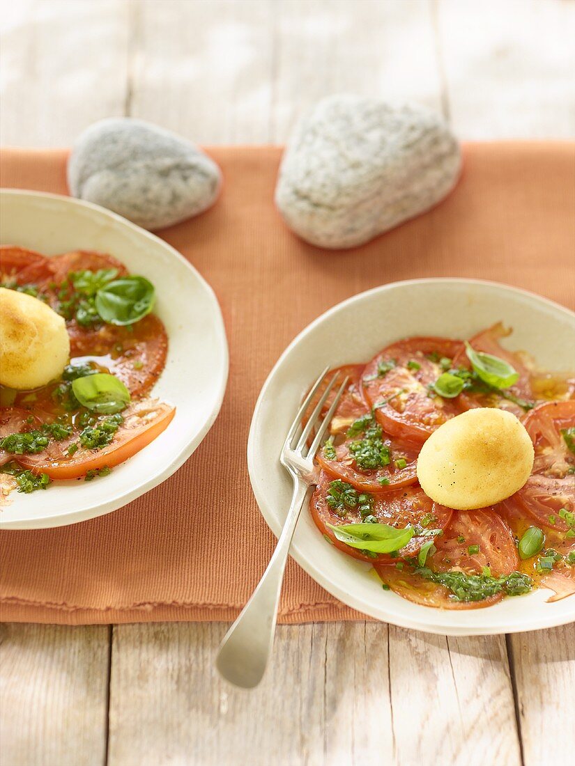 Warm tomato salad with fried boiled egg