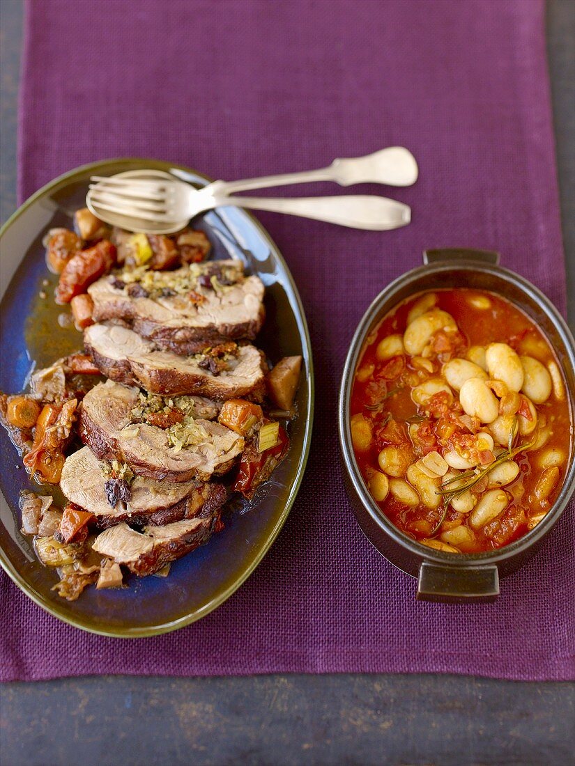 Provençal roast lamb with bean and tomato pot-au-feu