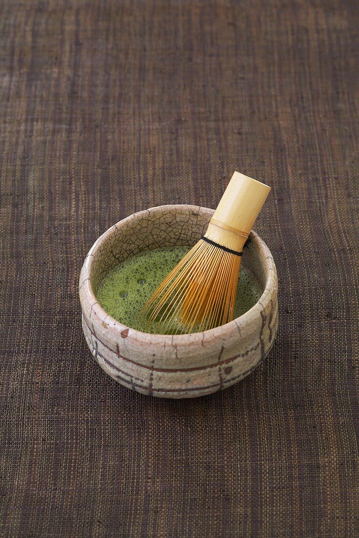 Bowl of matcha tea and bamboo whisk (Japan)