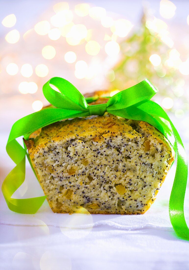 Poppy seed loaf cake with green ribbon for Christmas