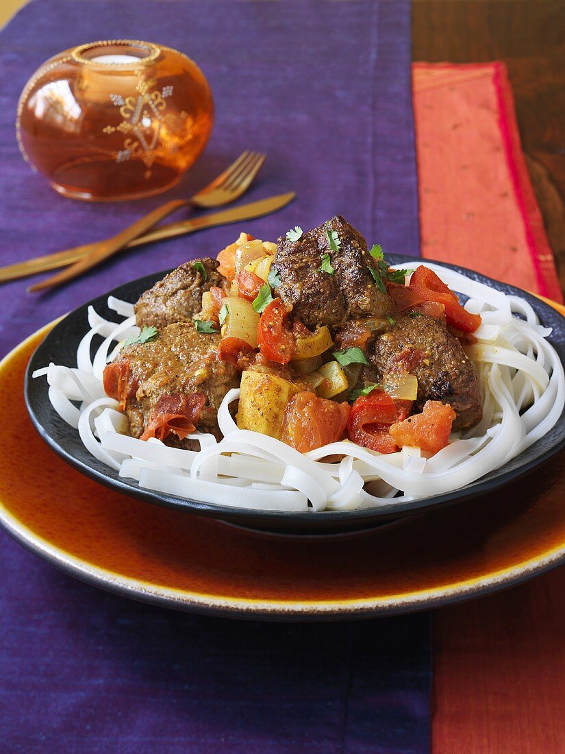 West Indian beef curry on rice noodles