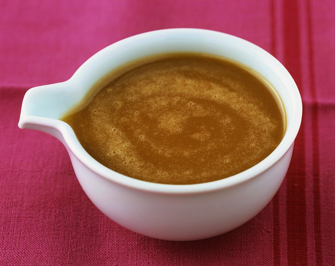 Caramel sauce in sauce-boat