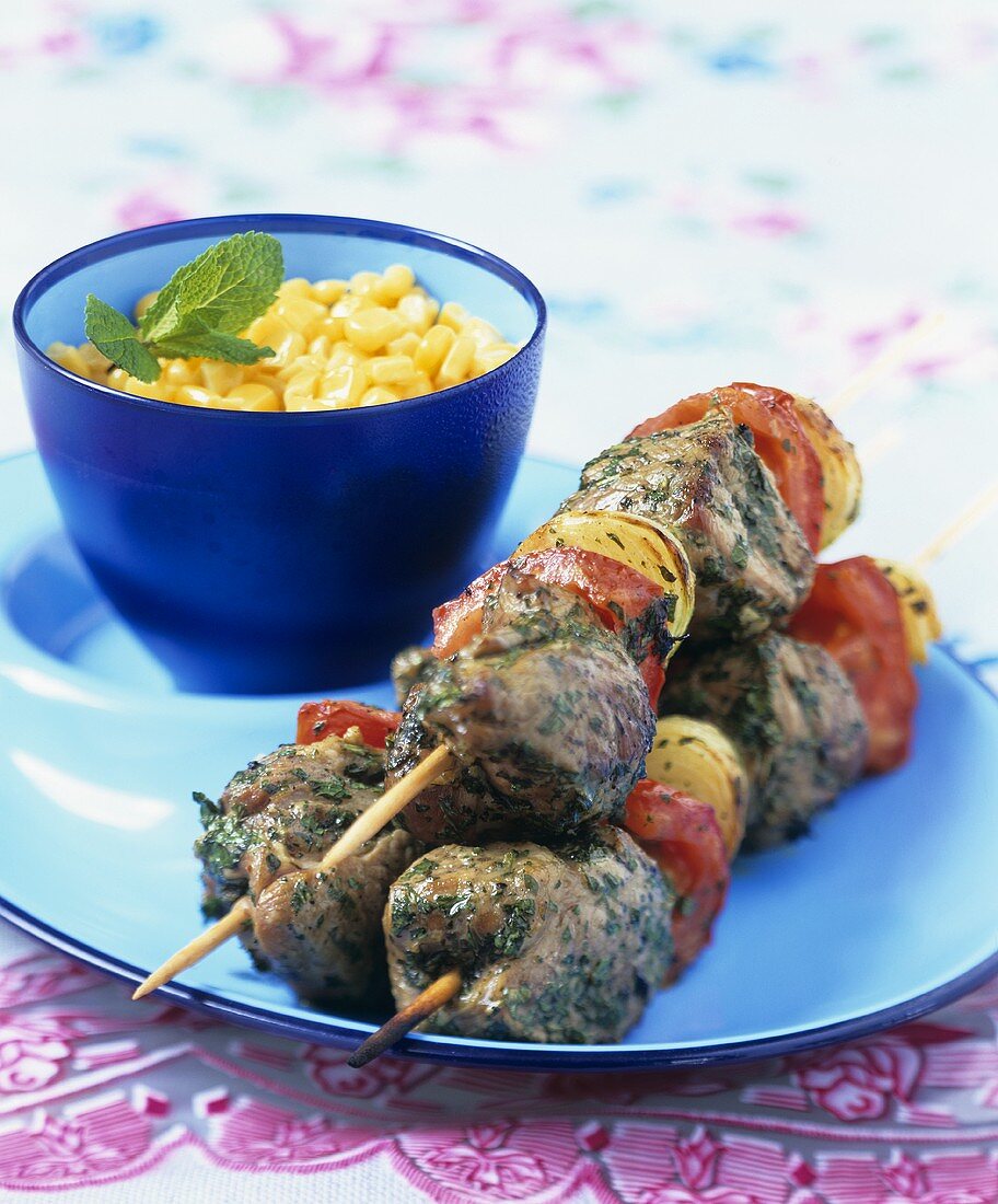 Mutton and vegetable kebabs and sweetcorn