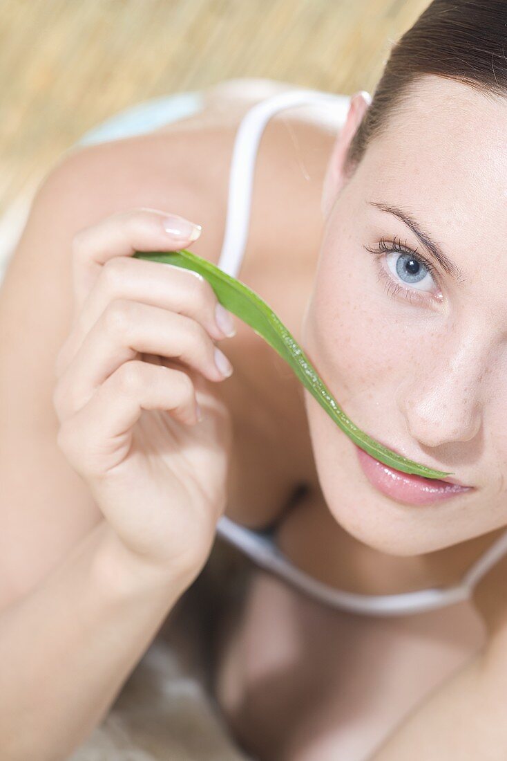 Young woman with Aloe vera