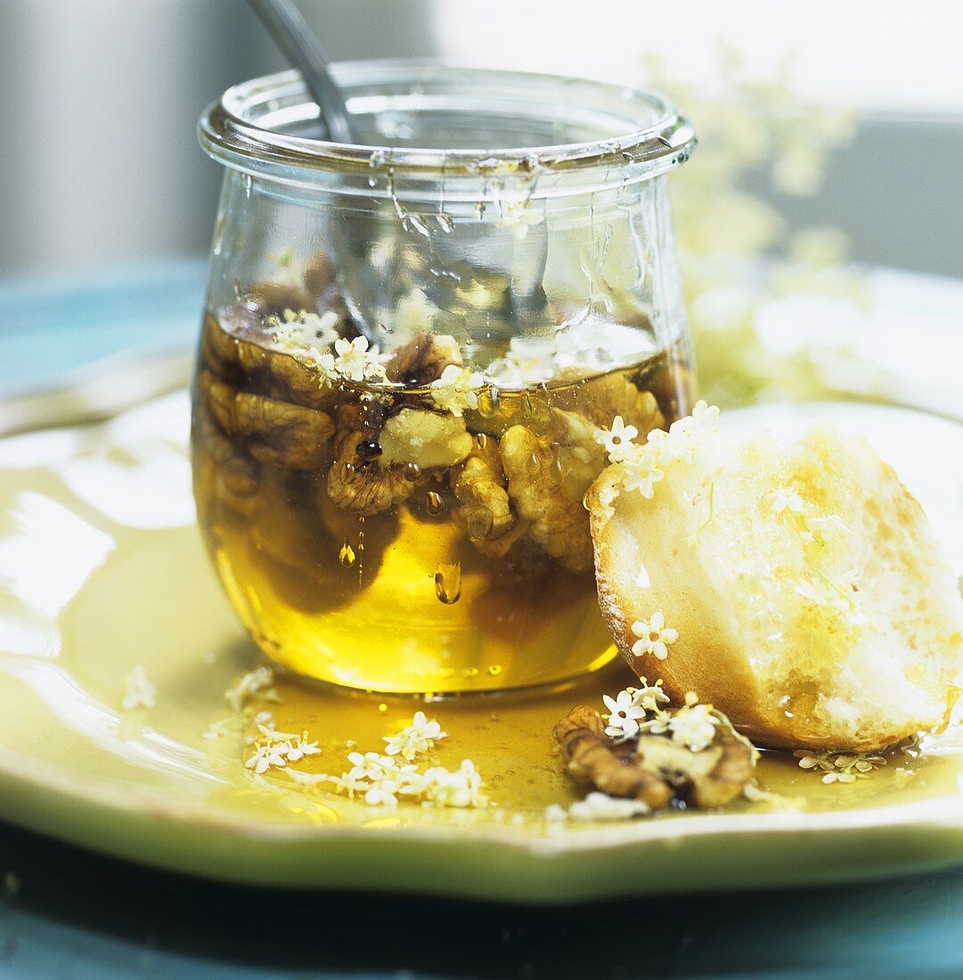 Yeast bun with elderflowers and walnuts in honey