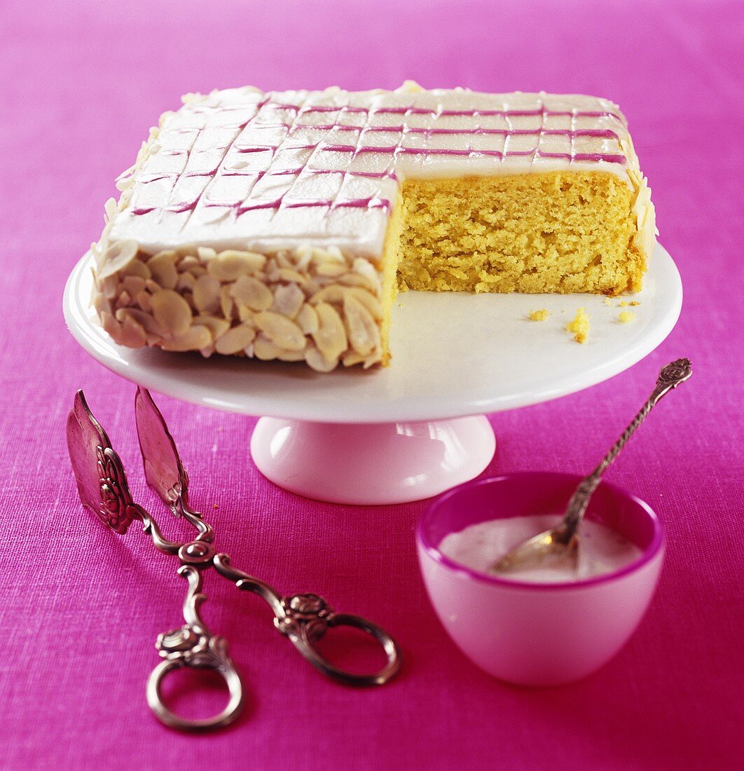 Iced cake with flaked almonds