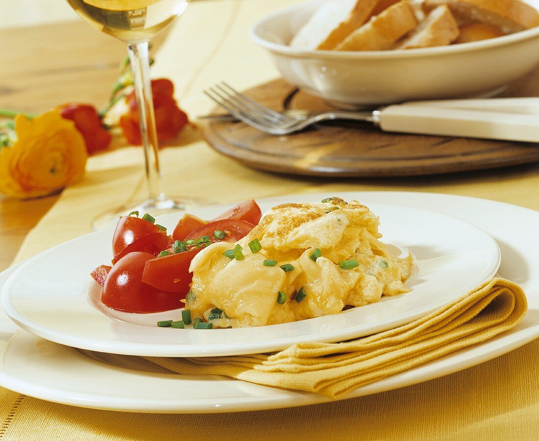 Scrambled egg with chives and tomato salad