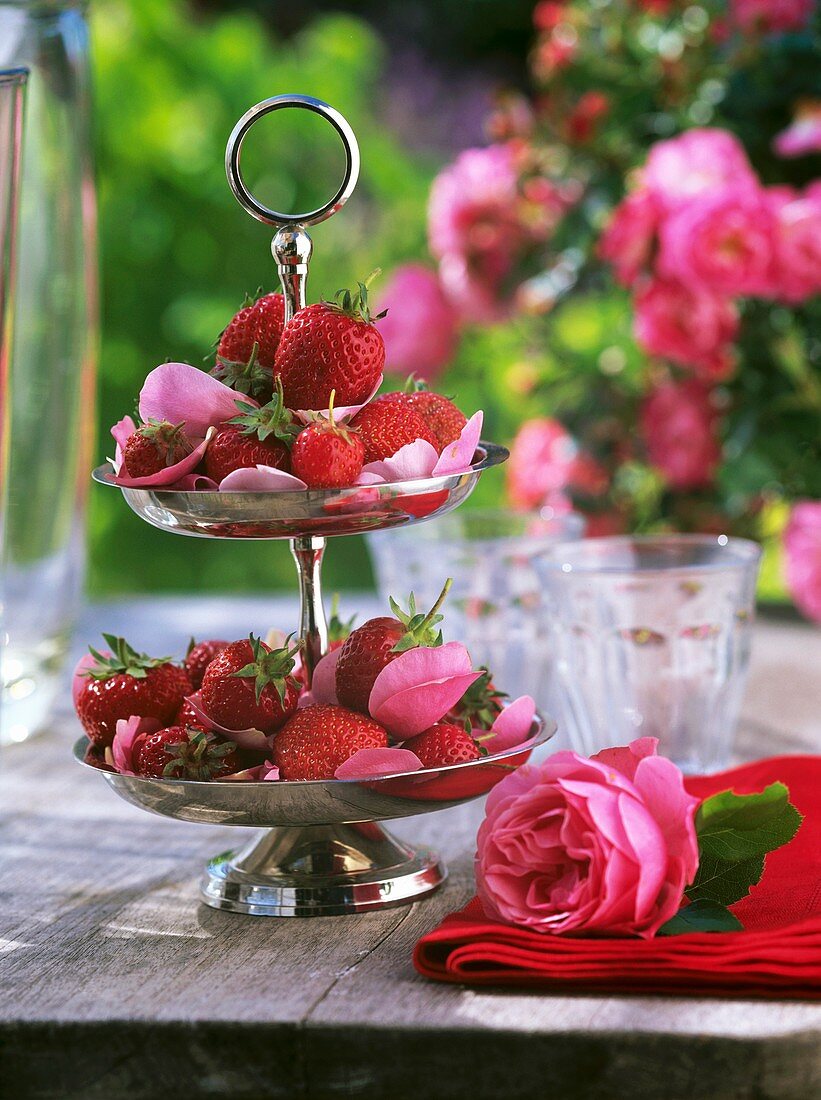 Strawberries and rose petals on tiered stand