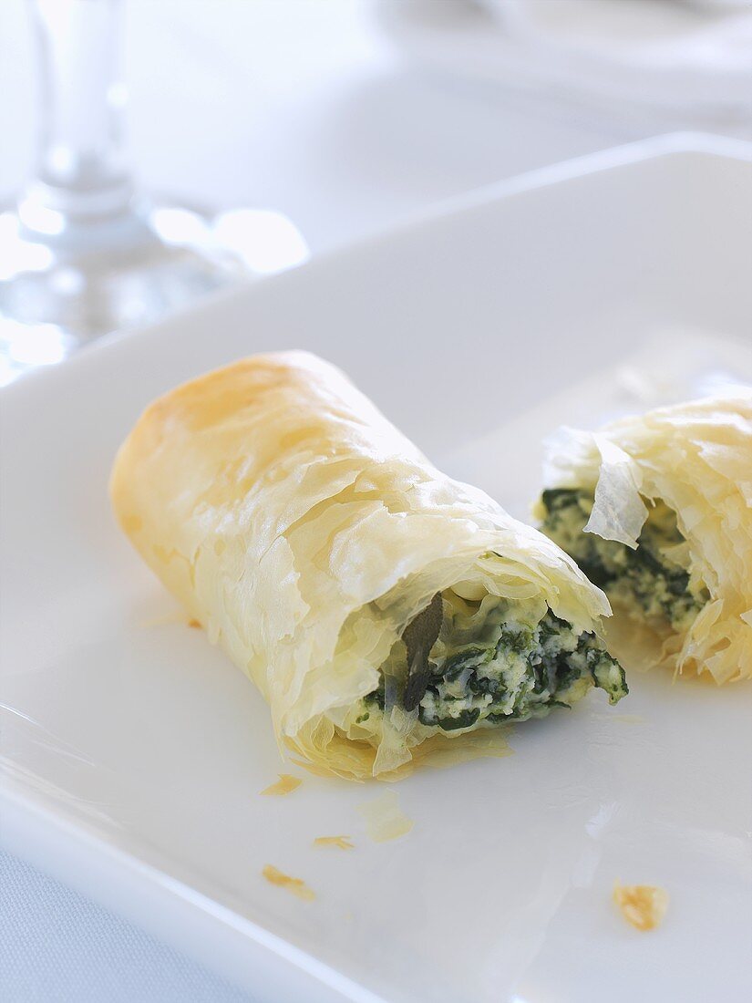 Filo pastry roll filled with spinach, ricotta and sage