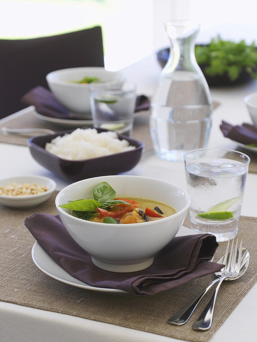Thai curry on laid table